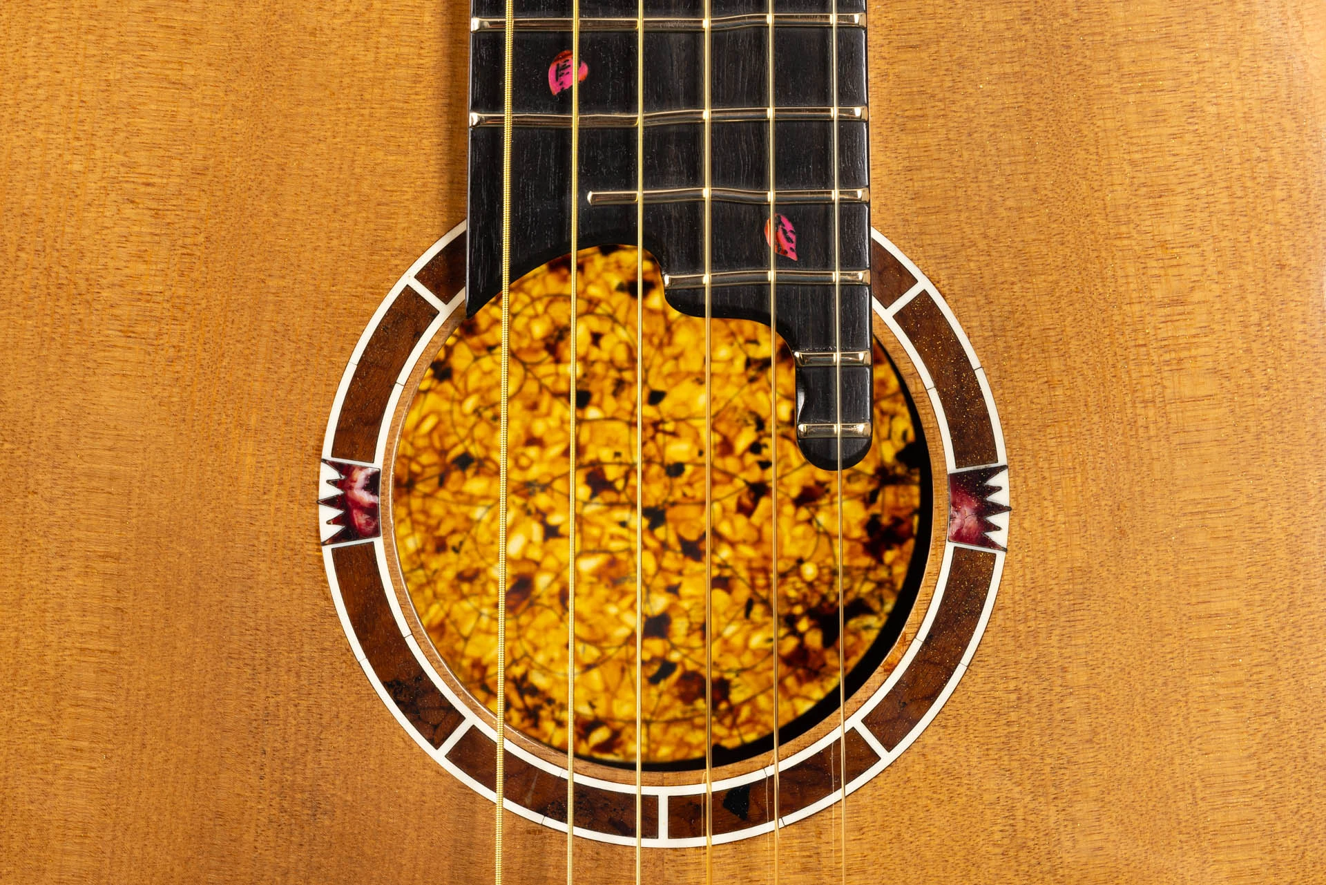 Spring from Four Seasons: floral rosette, ladybird inlays and illuminated amber